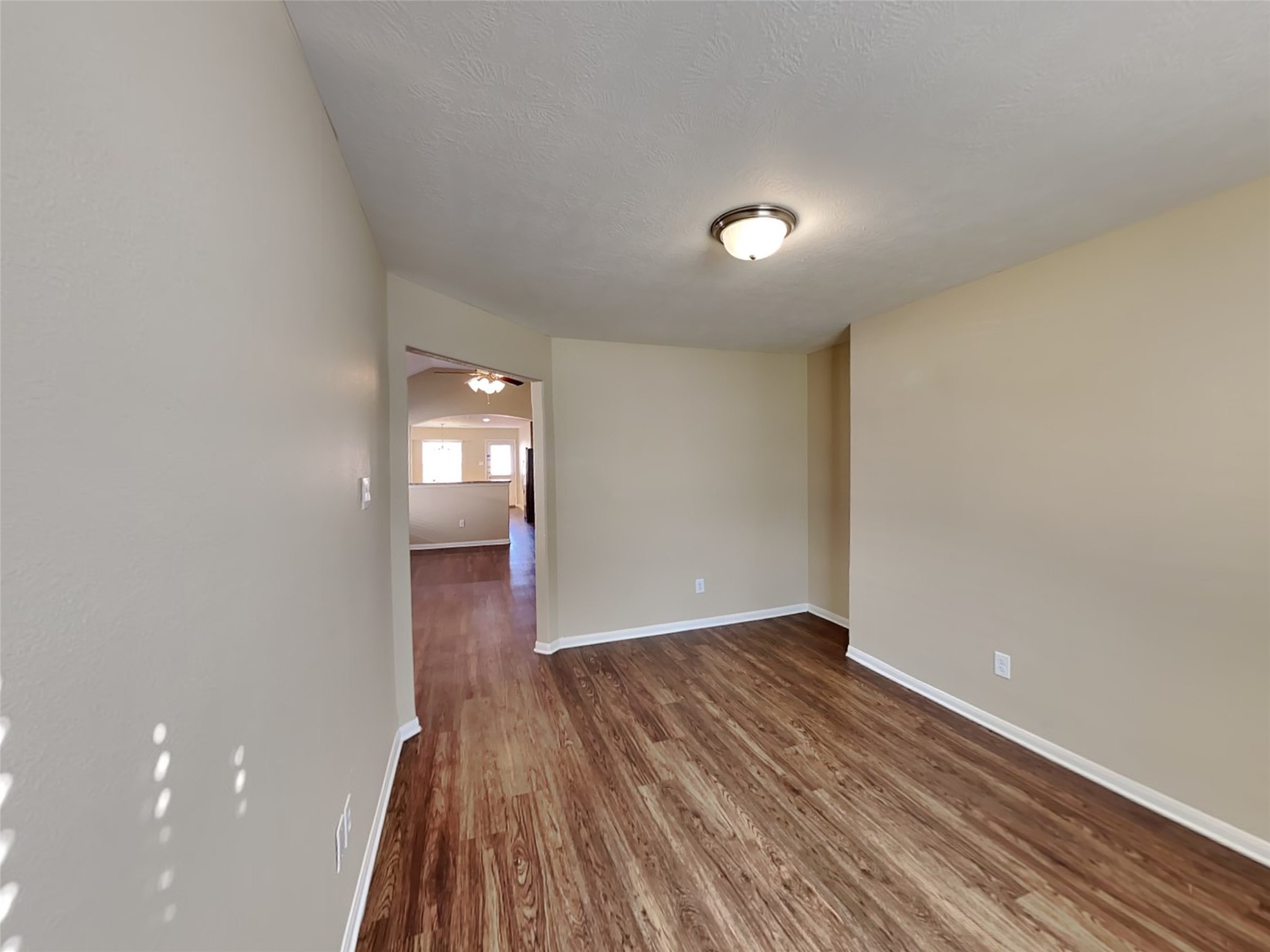 8119 Silent Deep Drive Rosenberg, TX 77469 - Photo 6 of 20 an empty room with wooden floor and mirror