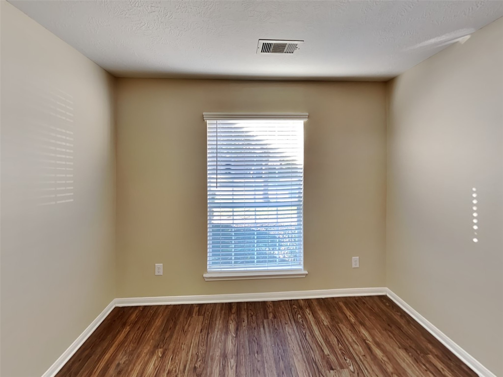 8119 Silent Deep Drive Rosenberg, TX 77469 - Photo 7 of 20 a view of a room with wooden floor and a window
