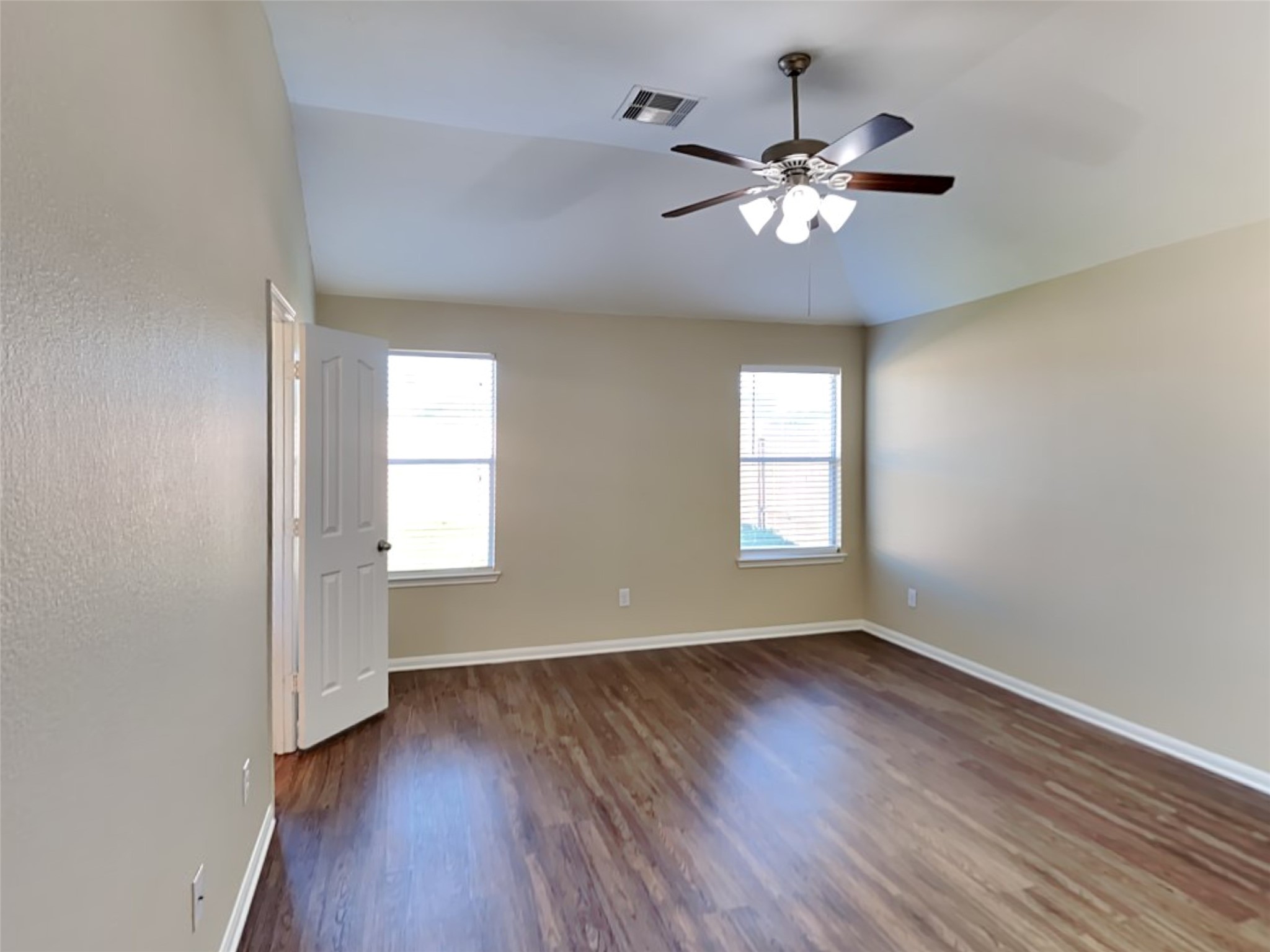 8119 Silent Deep Drive Rosenberg, TX 77469 - Photo 9 of 20 a view of an empty room with wooden floor and a window