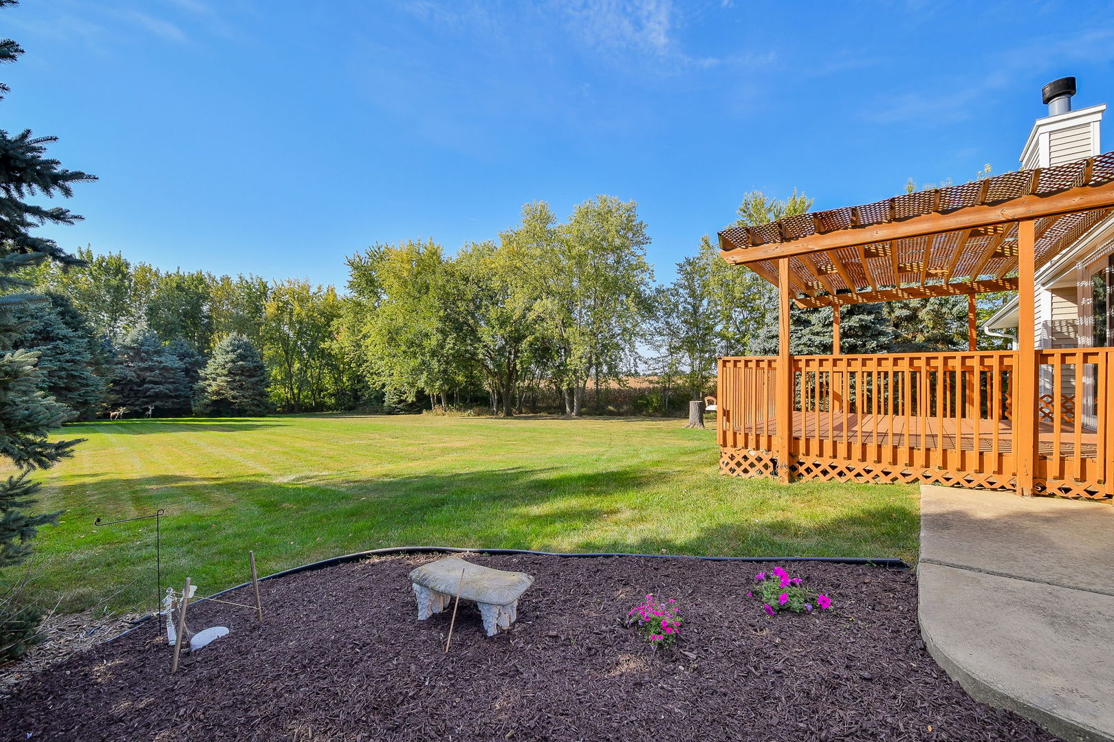 2917 Prairie Road Belvidere, IL 61008 - Photo 20 of 23 a view of a park with a bench in the park