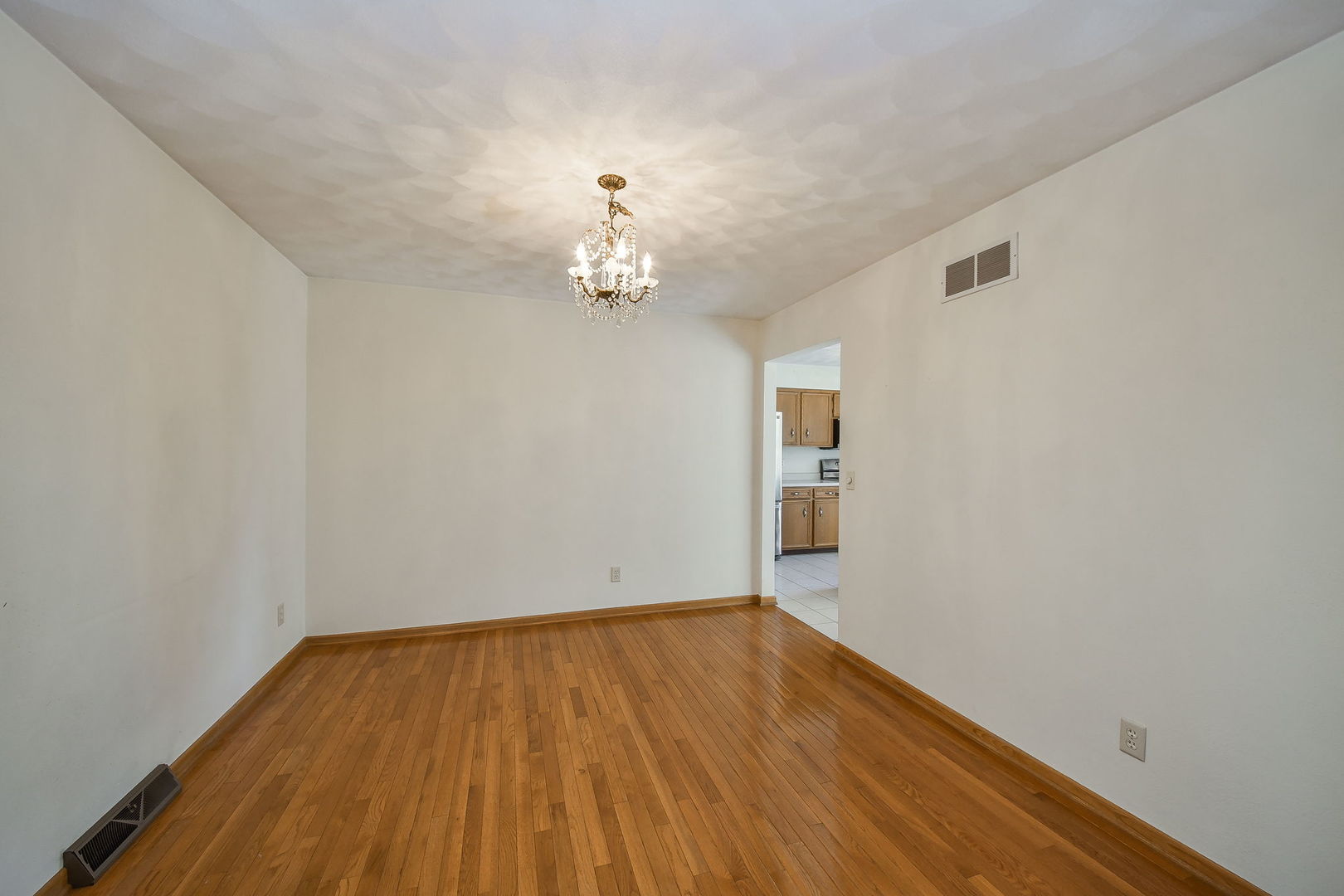 2917 Prairie Road Belvidere, IL 61008 - Photo 6 of 23 wooden floor in an empty room with a window