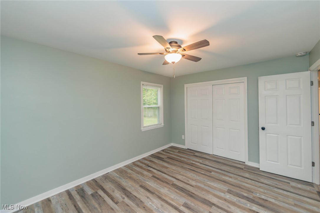 952 Murray Road South Euclid, OH 44121 - Photo 11 of 30 Unfurnished bedroom featuring ceiling fan, a closet, and light hardwood / wood-style floors