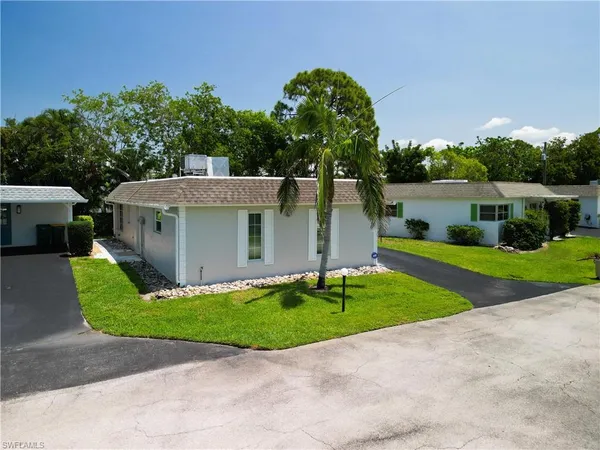 a view of a house with a yard