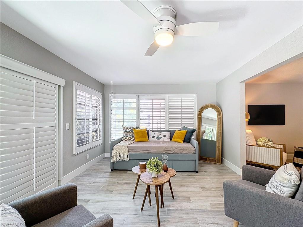 9 Knights Bridge Road, Unit 30 Naples, FL 34112 - Photo 15 of 47 a living room with furniture and a flat screen tv