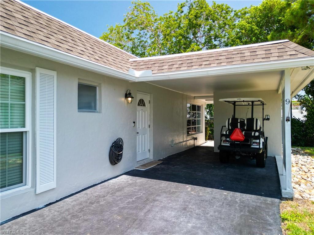 9 Knights Bridge Road, Unit 30 Naples, FL 34112 - Photo 3 of 47 a view of a house with porch