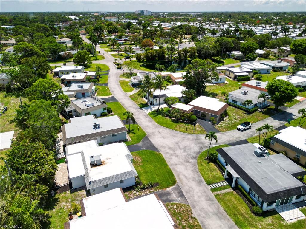 9 Knights Bridge Road, Unit 30 Naples, FL 34112 - Photo 46 of 47 an aerial view of residential houses with outdoor space