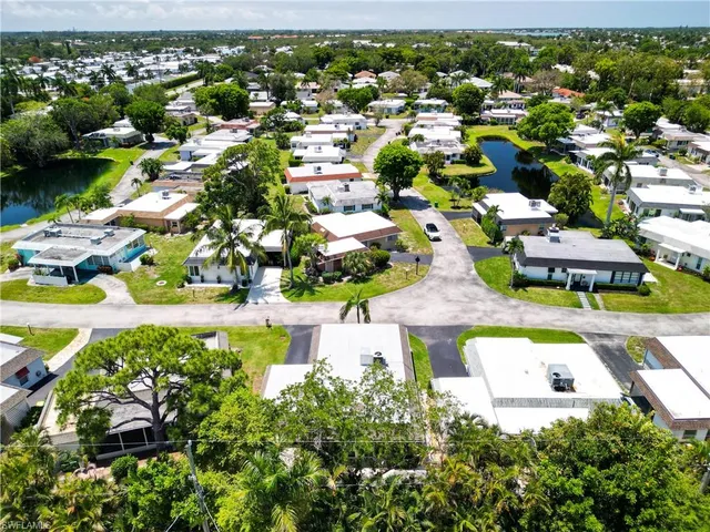a view of multiple houses with yard