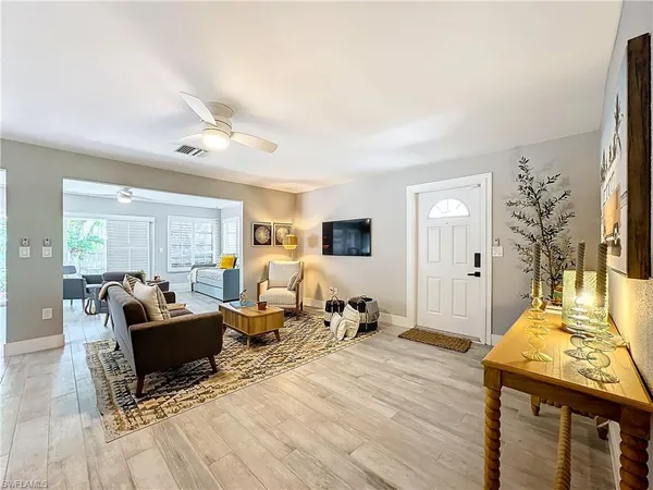 a living room with furniture and a table
