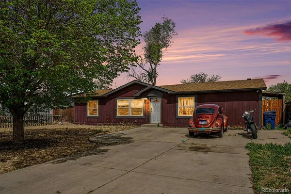 a view of a car is parked in front of a house