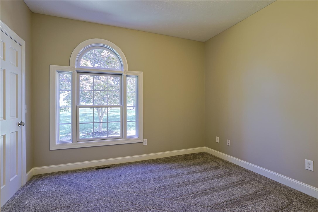 3681 Wilmington Road Lebanon, OH 45036 - Photo 37 of 87 Bright and airy bedroom features large window, offering abundant natural light and serene outdoor views.