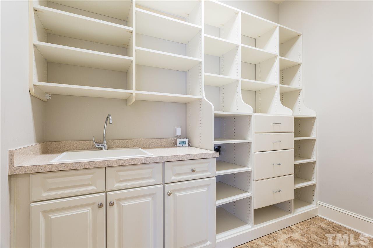7005 Potomac Court Raleigh, NC 27613 - Photo 14 of 30 a view of cabinets with wooden floor