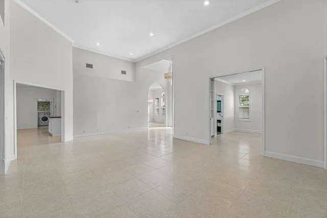 a view of a hallway with wooden shelves