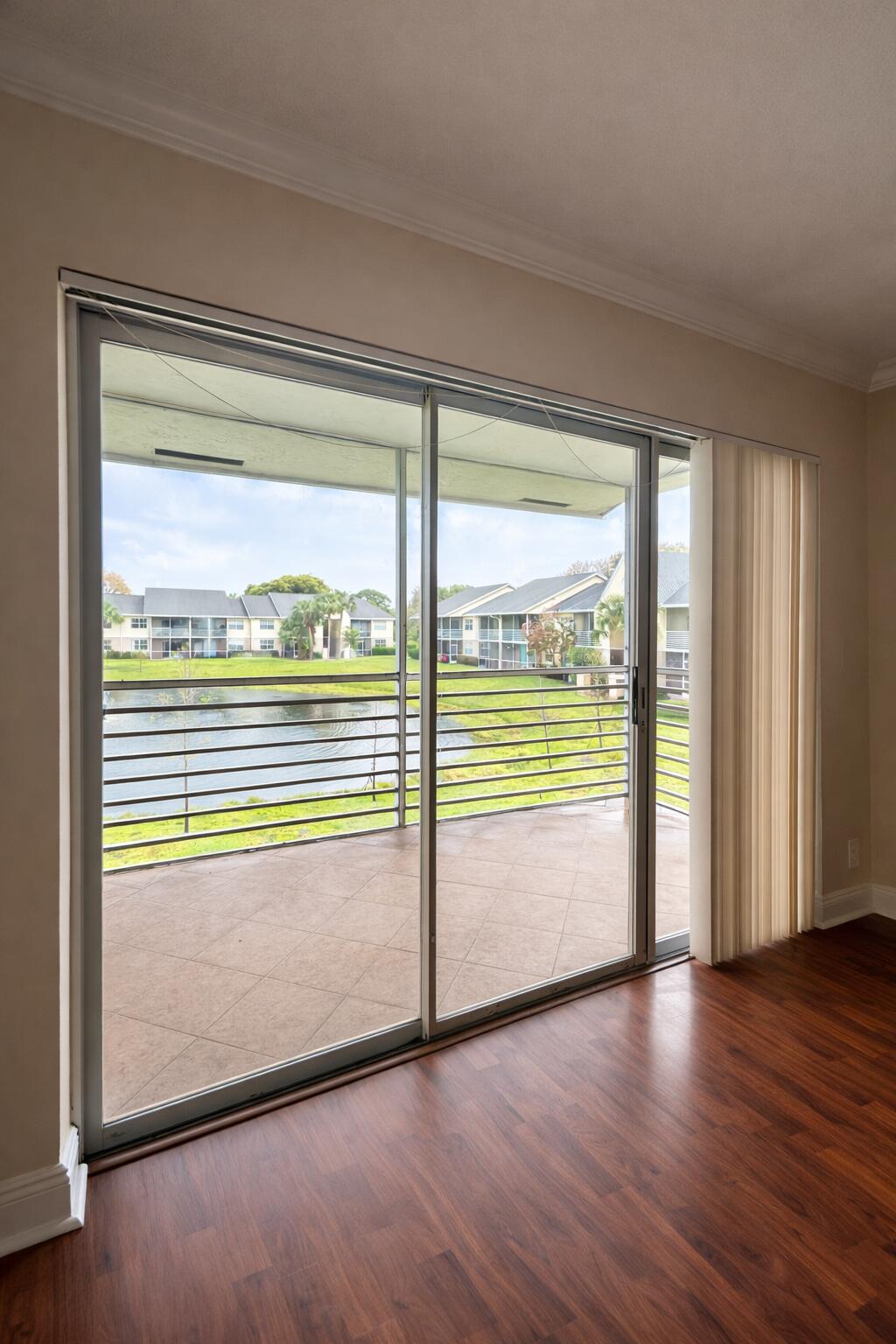 2837 North Course Drive, Unit 202 Pompano Beach, FL 33069 - Photo 13 of 15 Balcony view over calm pond (1)