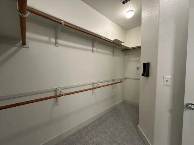 a bathroom with double vanity sink and a mirror