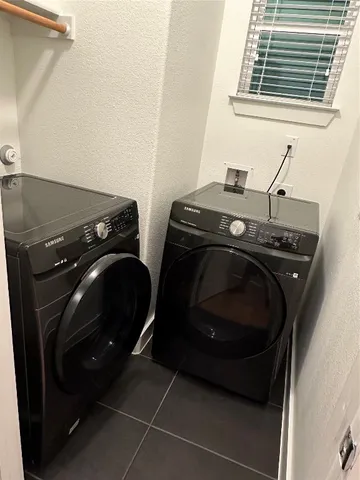 a view of a house with wooden fence