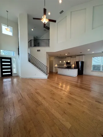 a kitchen with stainless steel appliances a large counter top space appliances and cabinets
