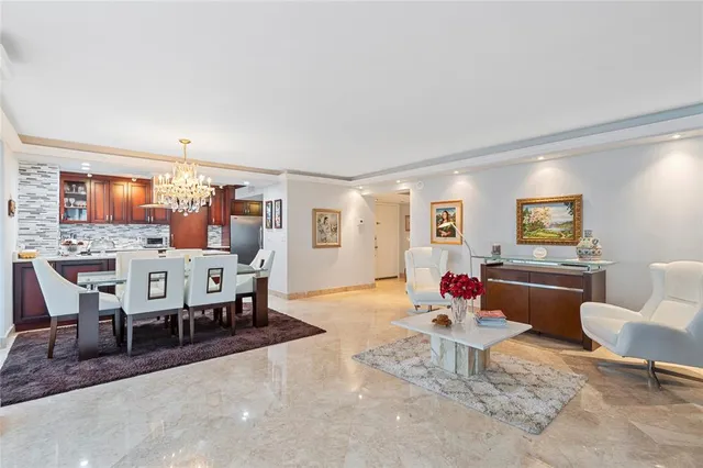 a bathroom with a granite countertop sink a large mirror and a toilet