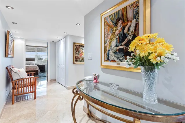 a view of a kitchen with furniture and wooden floor