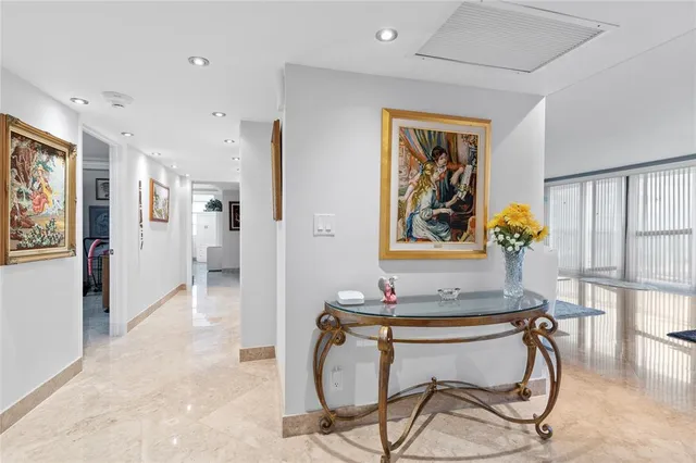 a view of a hallway with wooden shelves