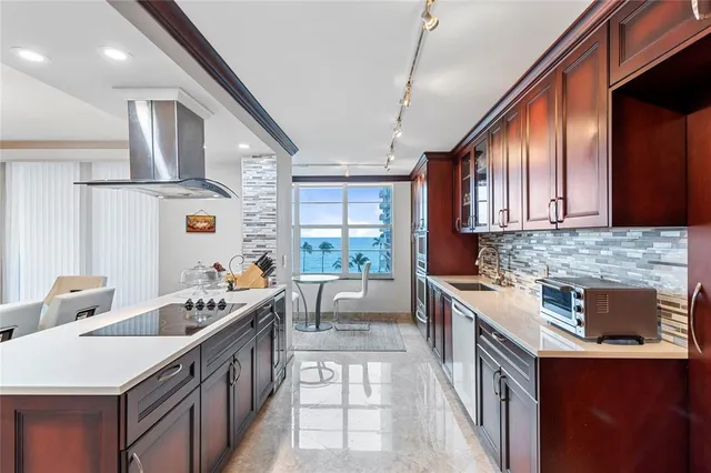 a view of a a dining room with furniture window and wooden floor