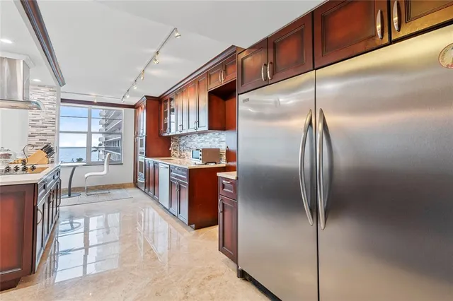 a bathroom with a toilet a sink and a window