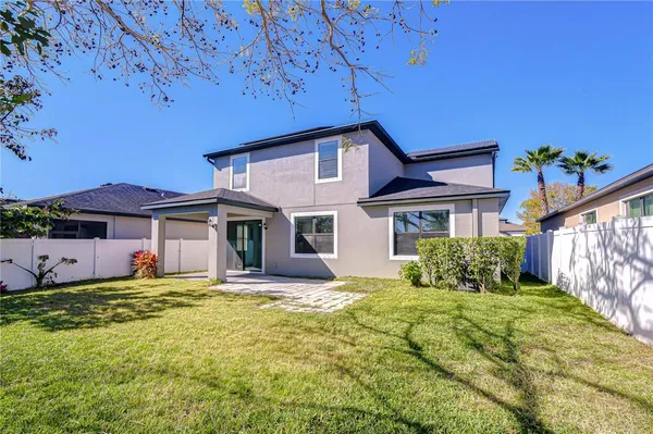a house that has a big yard in front of it