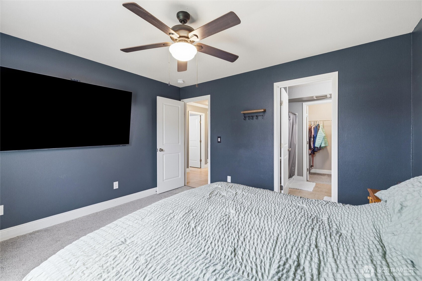 953 3rd Street, Unit 101 Blaine, WA 98230 - Photo 12 of 28 a bedroom with a bed and a flat screen tv