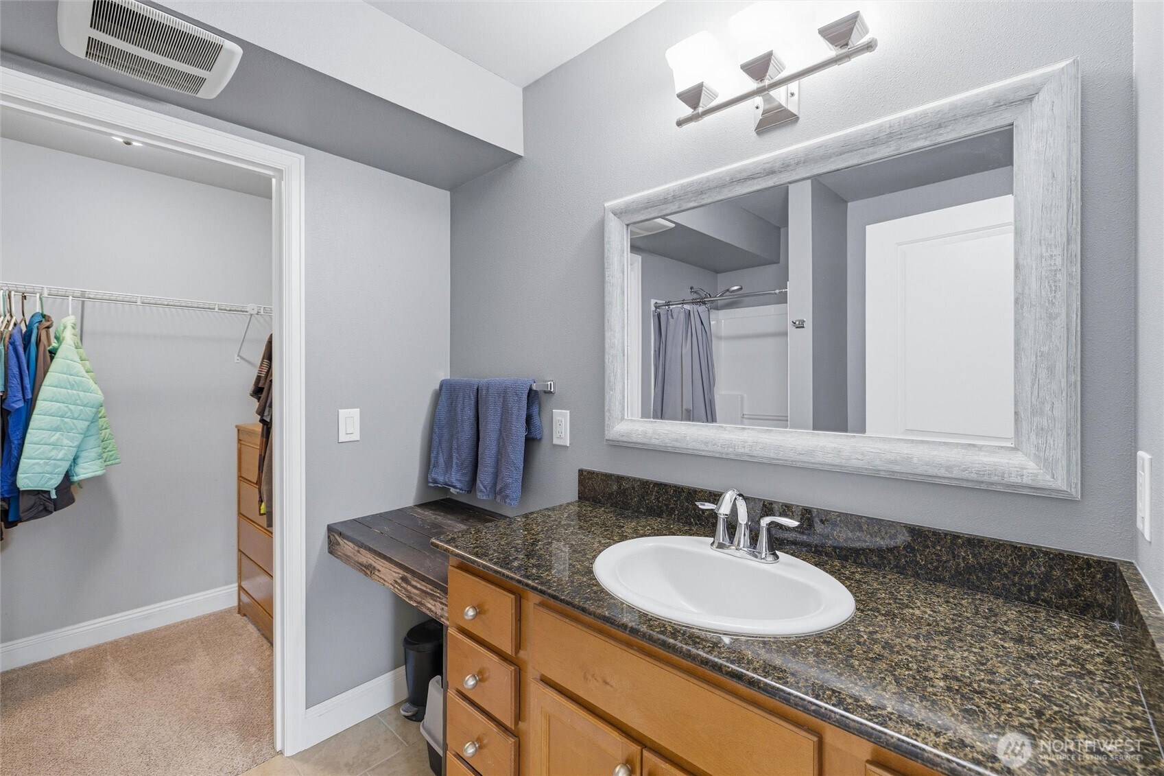 953 3rd Street, Unit 101 Blaine, WA 98230 - Photo 15 of 28 a bathroom with a granite countertop sink and a mirror