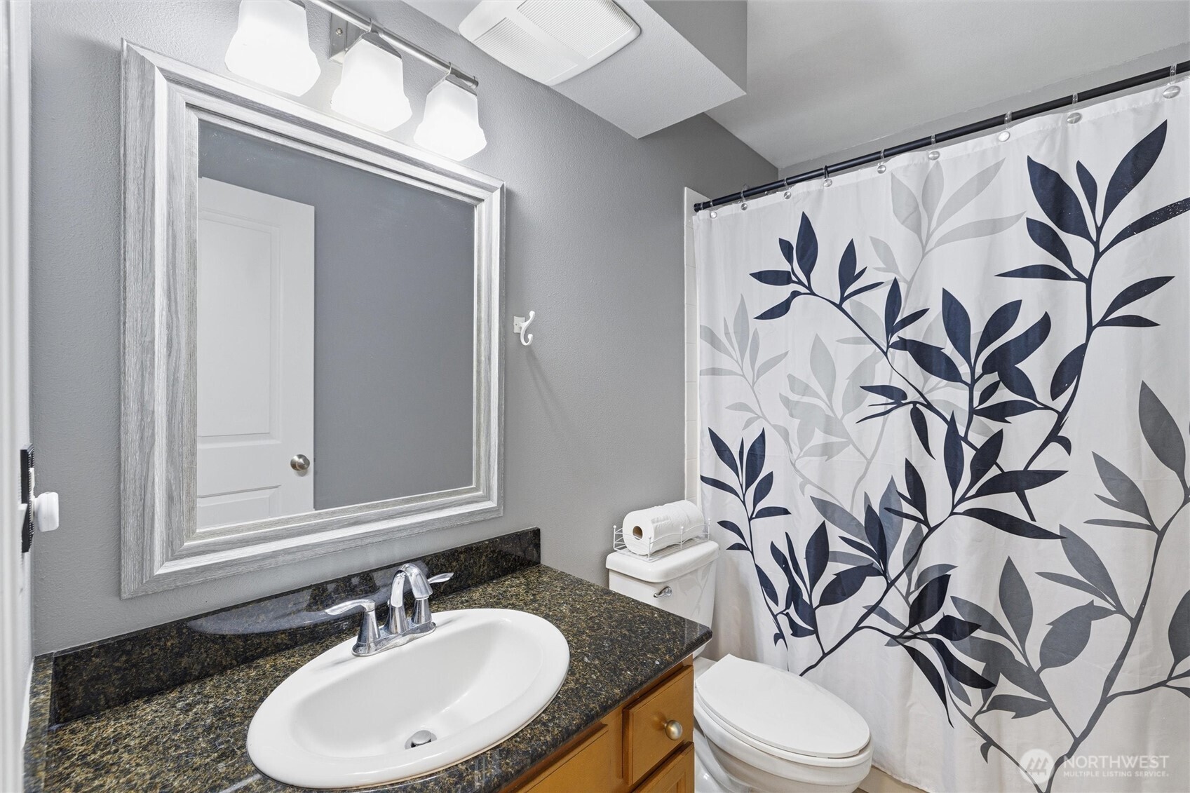 953 3rd Street, Unit 101 Blaine, WA 98230 - Photo 17 of 28 a bathroom with a toilet sink and mirror