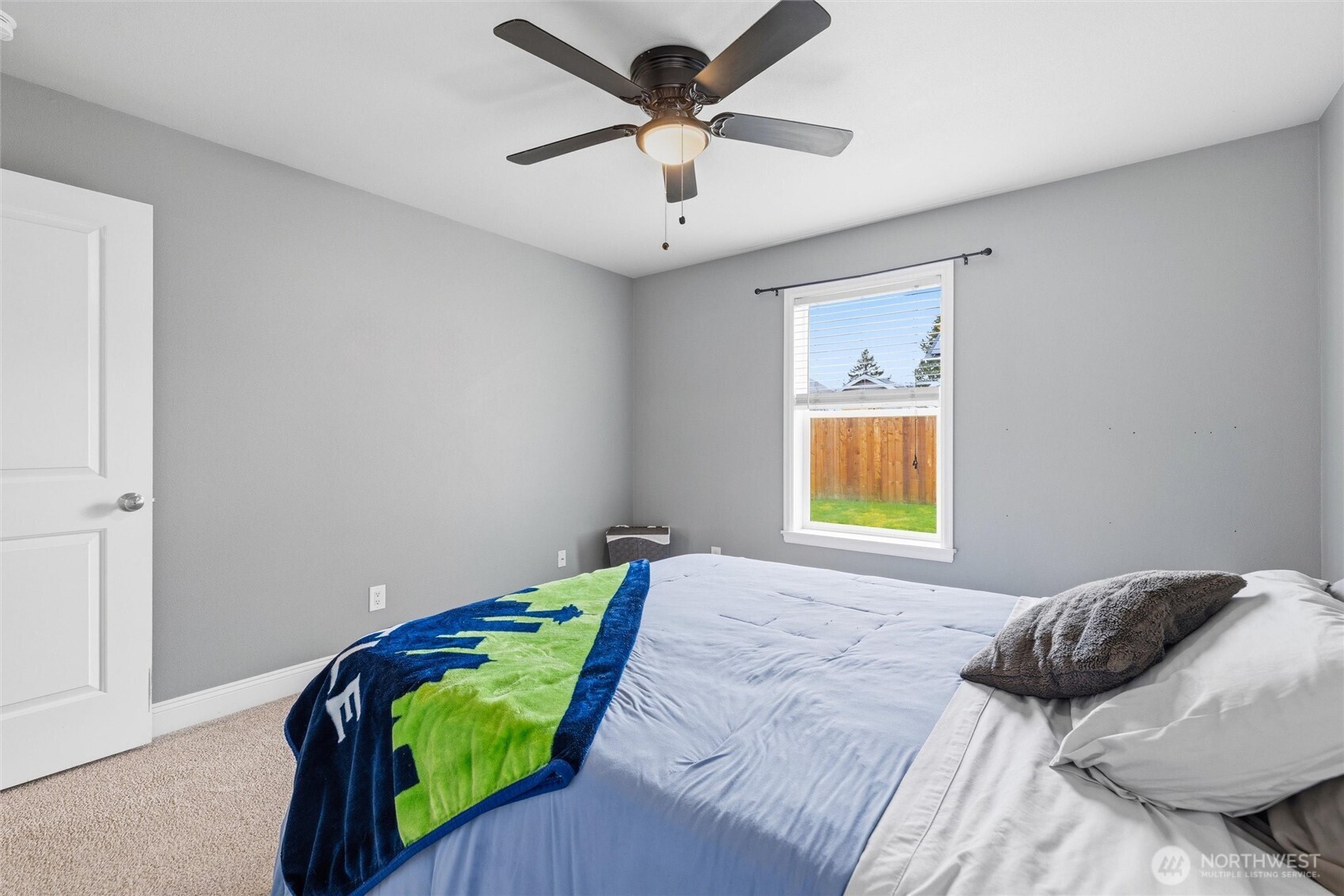 953 3rd Street, Unit 101 Blaine, WA 98230 - Photo 19 of 28 a bedroom with a bed and a window