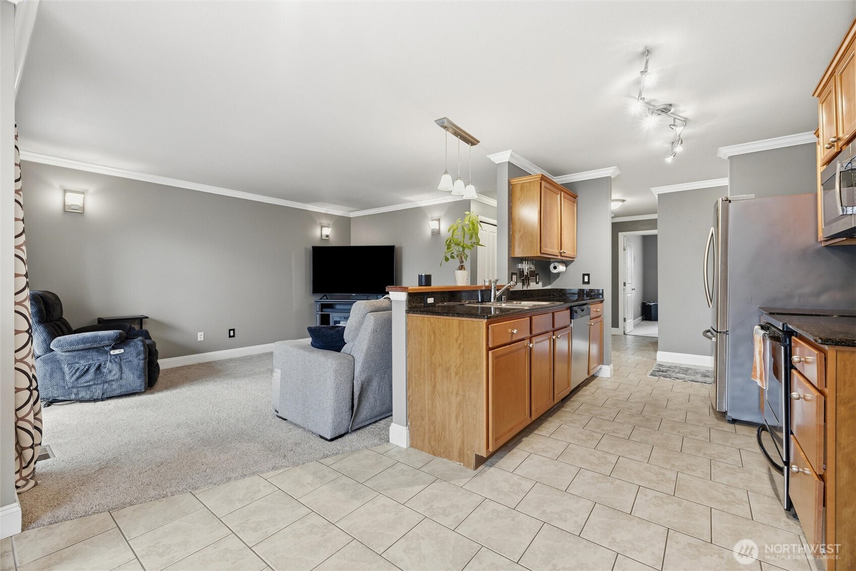 953 3rd Street, Unit 101 Blaine, WA 98230 - Photo 2 of 28 a kitchen with cabinets and stainless steel appliances
