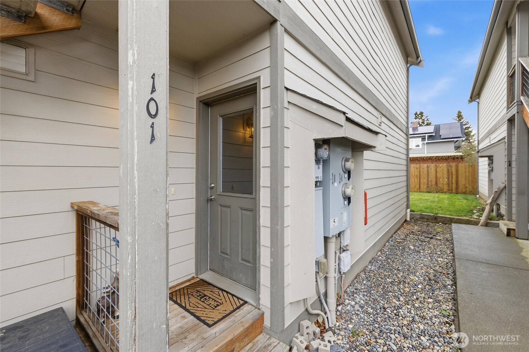953 3rd Street, Unit 101 Blaine, WA 98230 - Photo 25 of 28 a view of a house with a door and chair