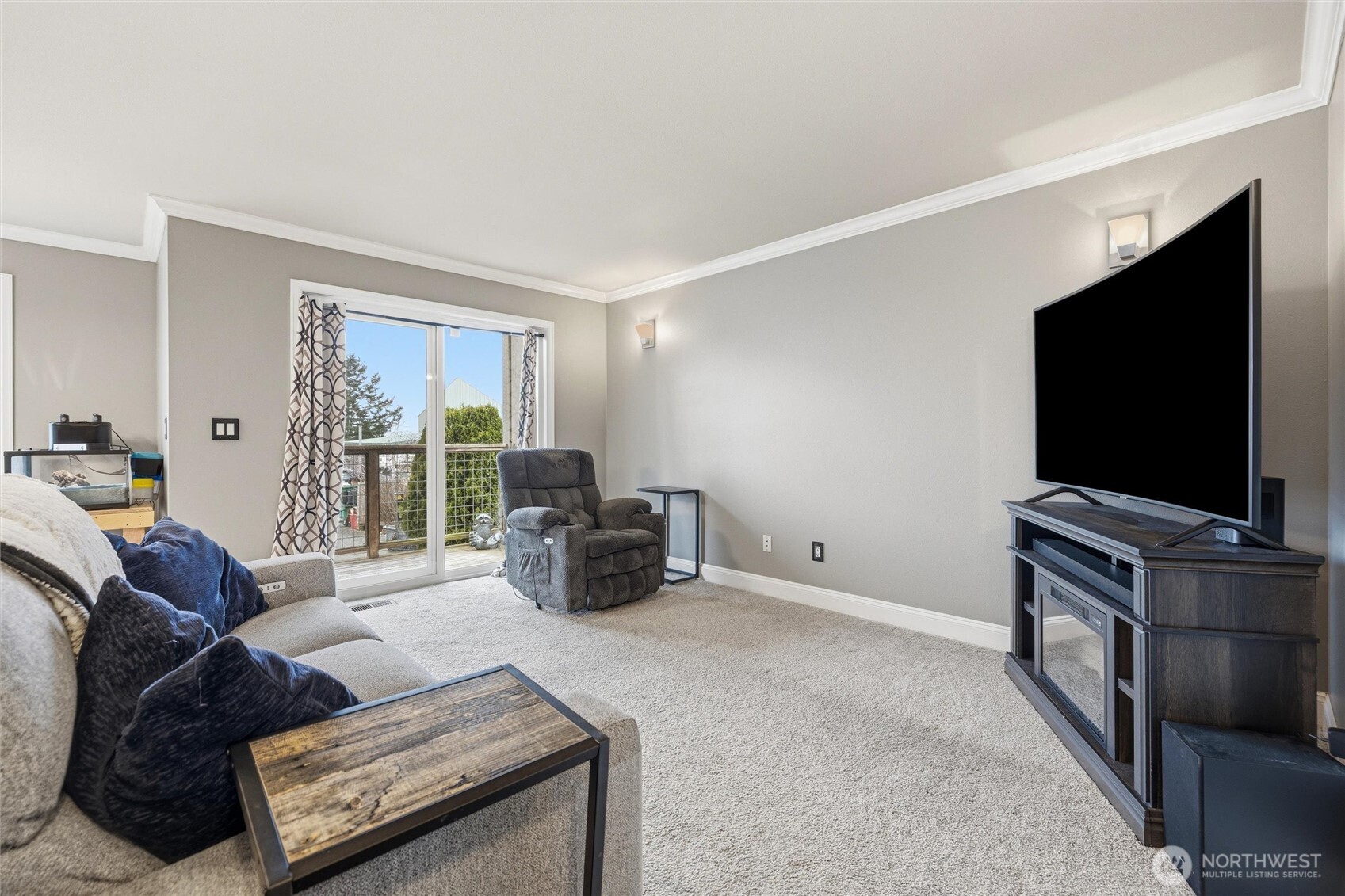 953 3rd Street, Unit 101 Blaine, WA 98230 - Photo 3 of 28 a living room with furniture and a flat screen tv