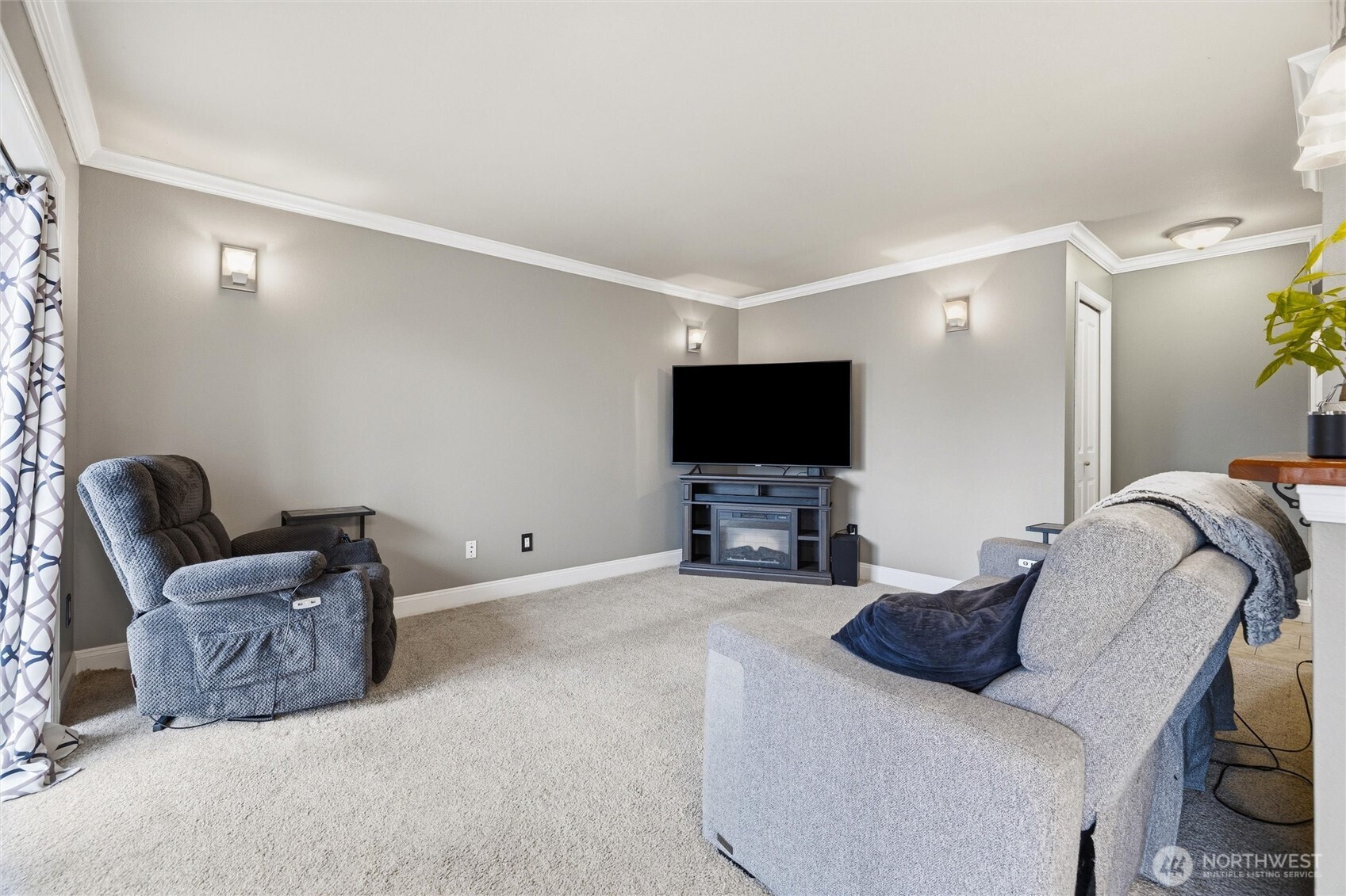 953 3rd Street, Unit 101 Blaine, WA 98230 - Photo 8 of 28 a living room with furniture and a flat screen tv