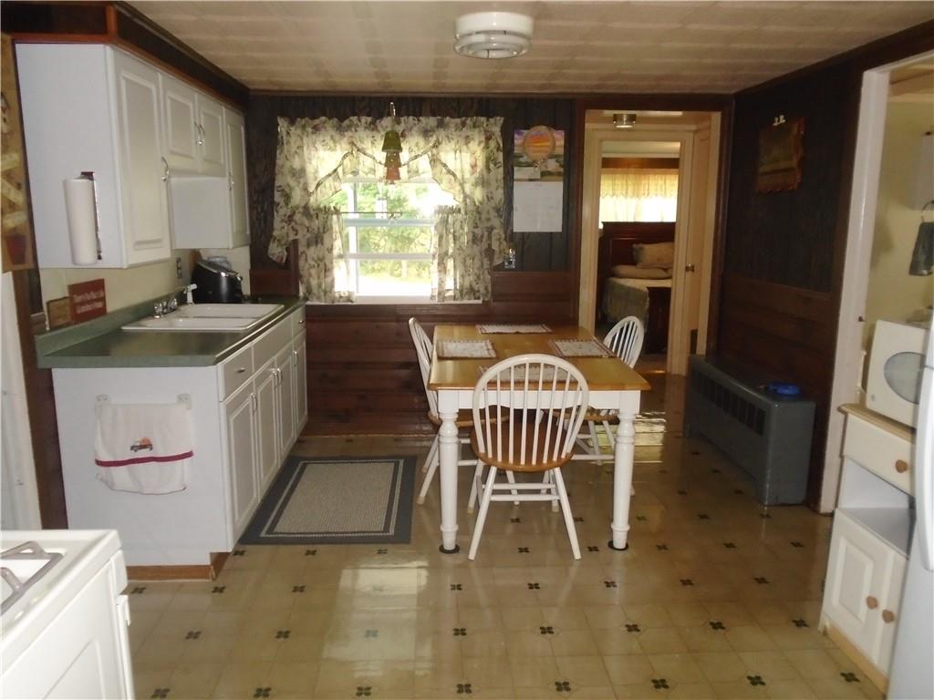 107 Mary Reed Road Baden, PA 15005 - Photo 3 of 23 a dining room with a sink and a mirror