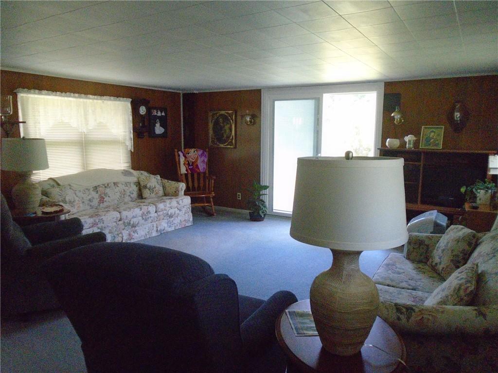 107 Mary Reed Road Baden, PA 15005 - Photo 8 of 23 a living room with furniture rug and window