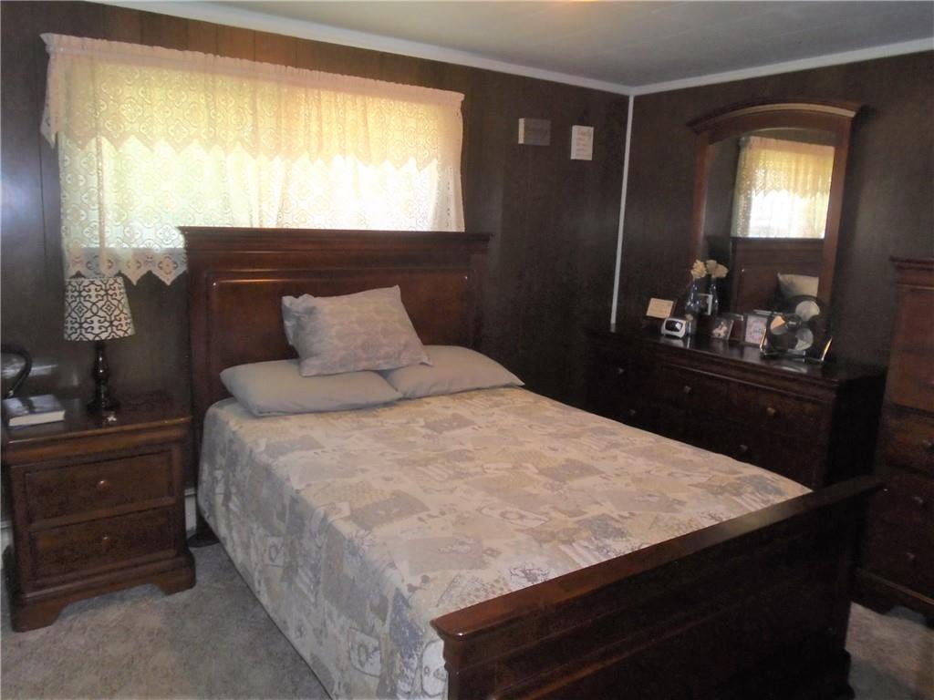 107 Mary Reed Road Baden, PA 15005 - Photo 10 of 23 a bedroom with a bed and a dresser