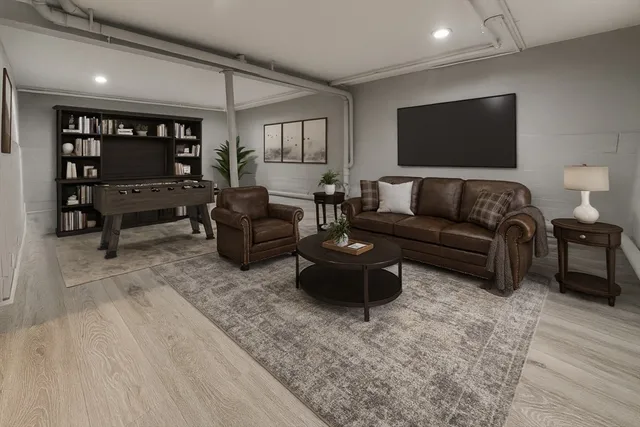 an empty room with wooden floor and a window