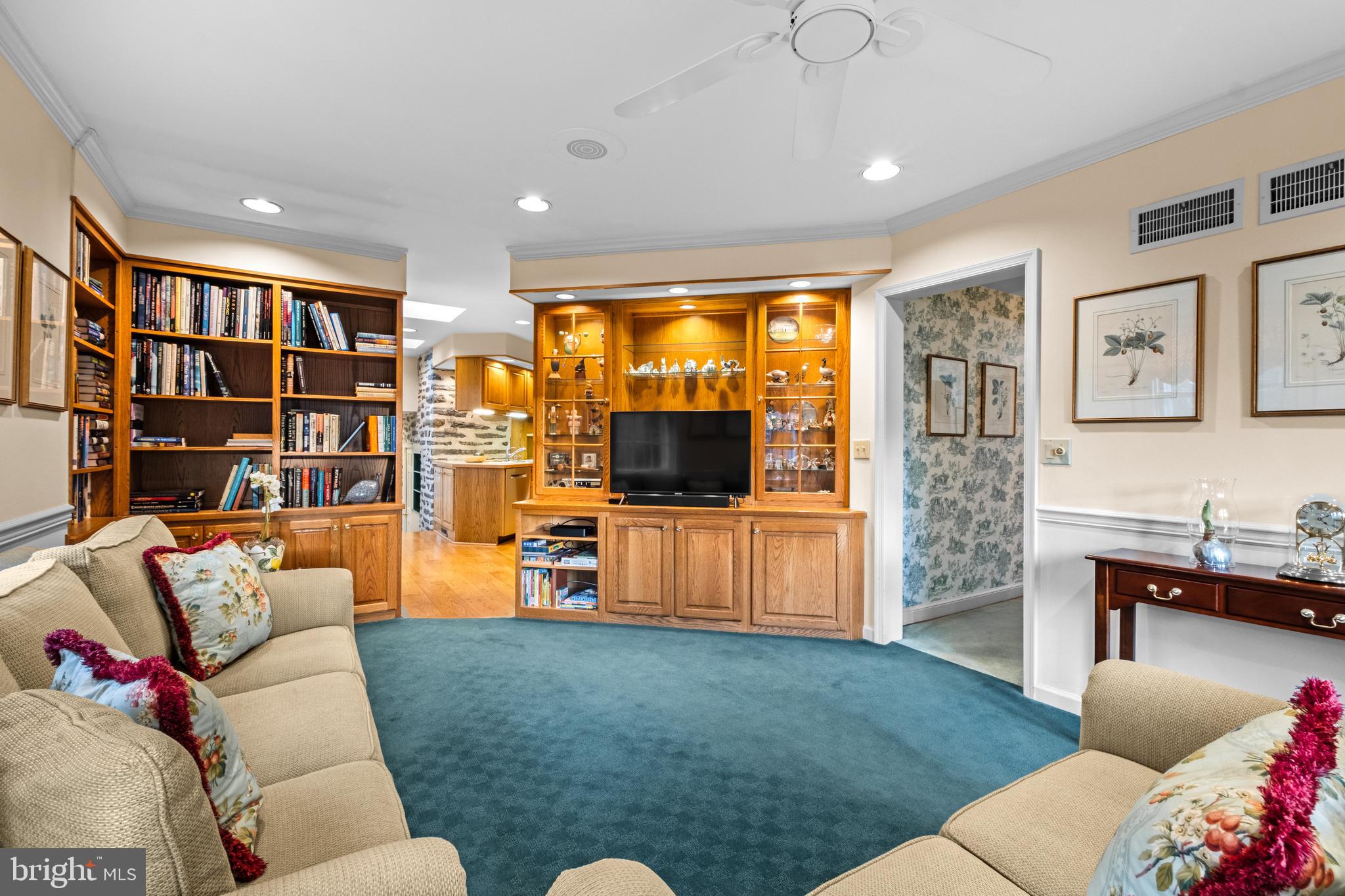 810 Merion Square Road Gladwyne, PA 19035 - Photo 12 of 32 a living room with furniture and a flat screen tv