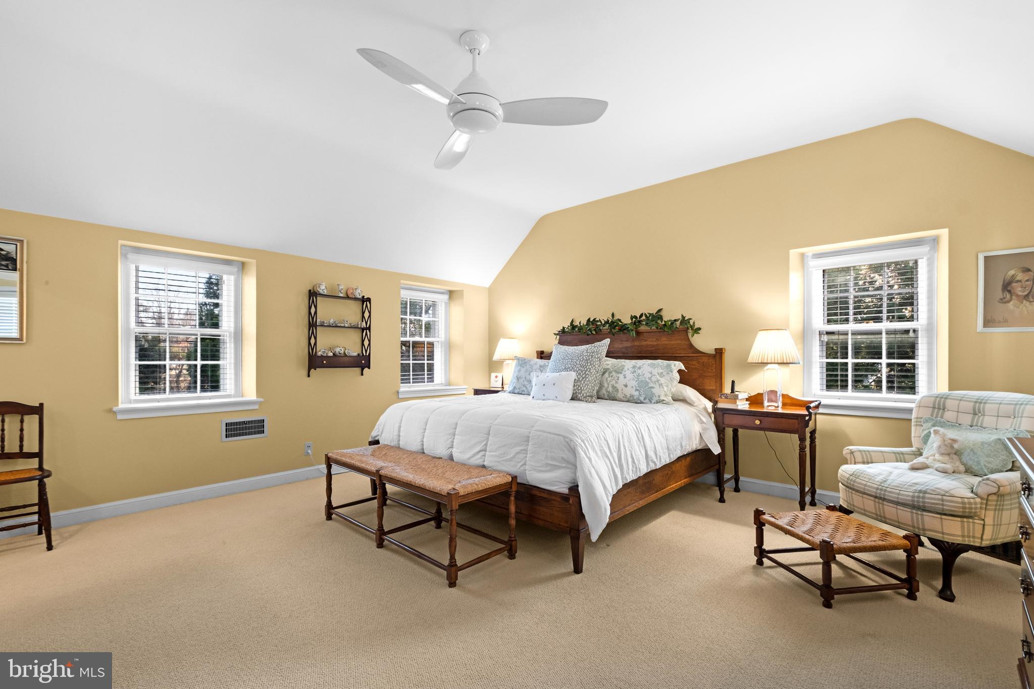 810 Merion Square Road Gladwyne, PA 19035 - Photo 15 of 32 a spacious bedroom with a bed and a table chair