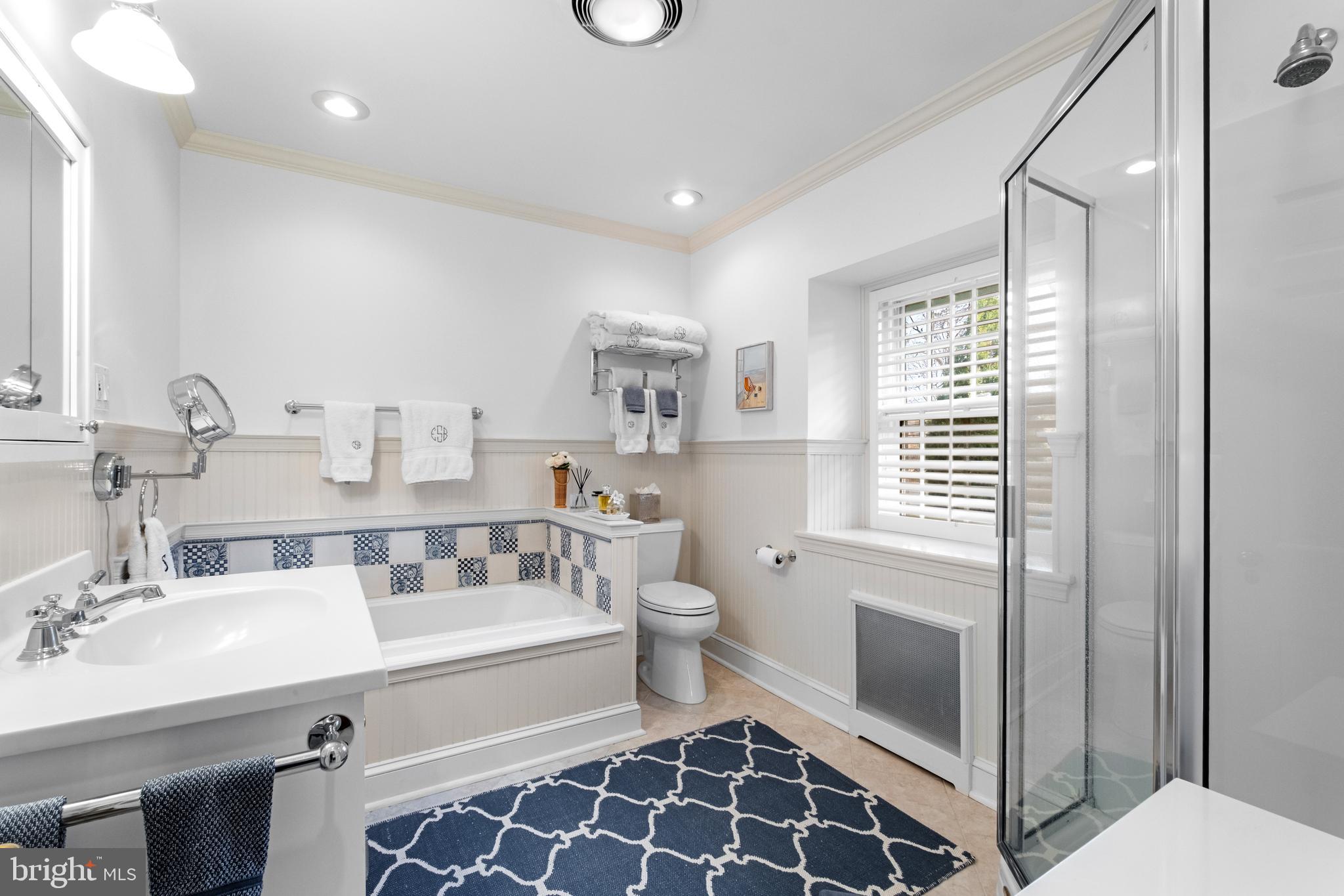 810 Merion Square Road Gladwyne, PA 19035 - Photo 16 of 32 a bathroom with a double vanity sink mirror and toilet