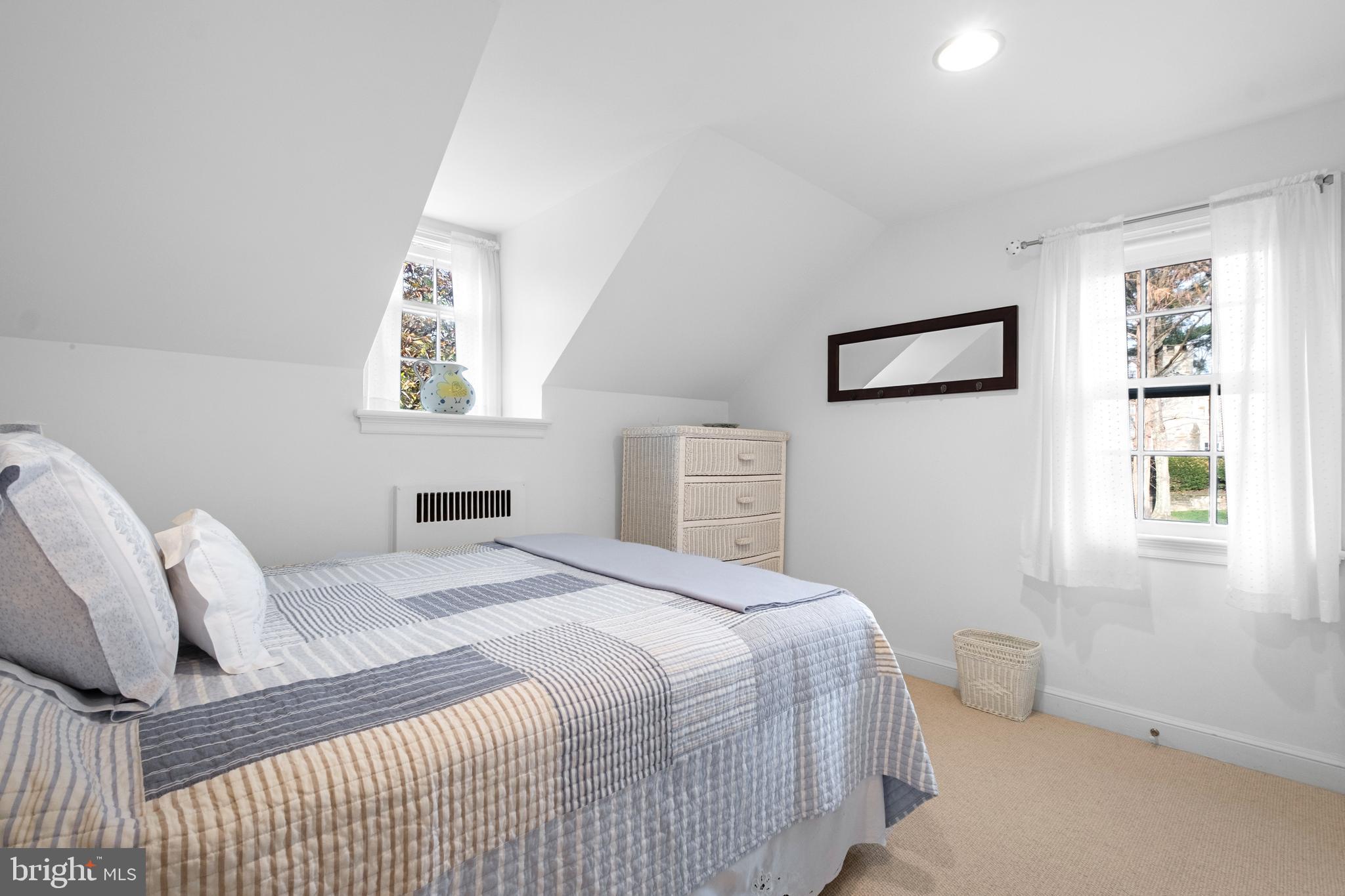 810 Merion Square Road Gladwyne, PA 19035 - Photo 24 of 32 a bedroom with a bed and a window