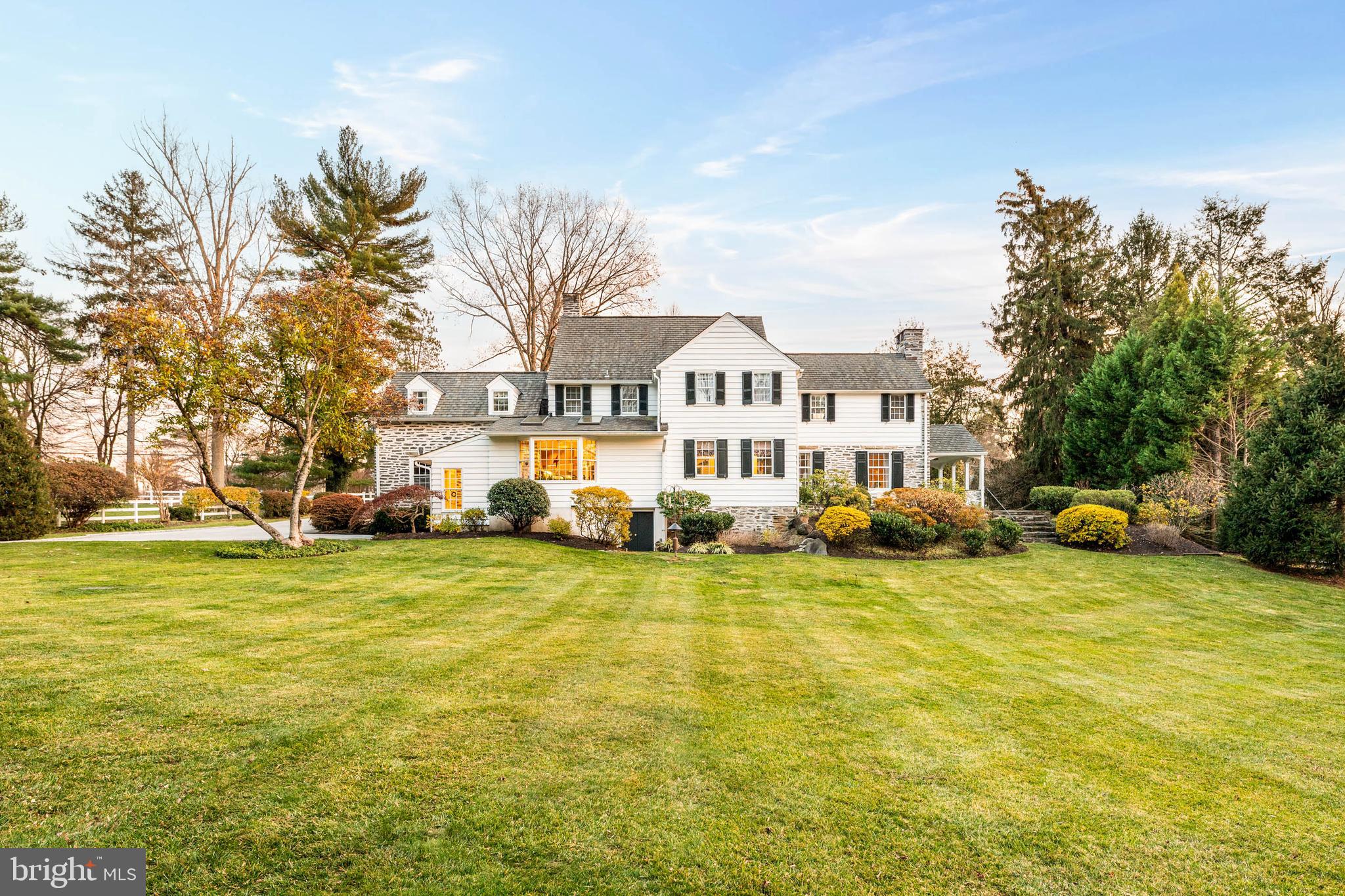 810 Merion Square Road Gladwyne, PA 19035 - Photo 3 of 32 a view of a house with a swimming pool and a yard