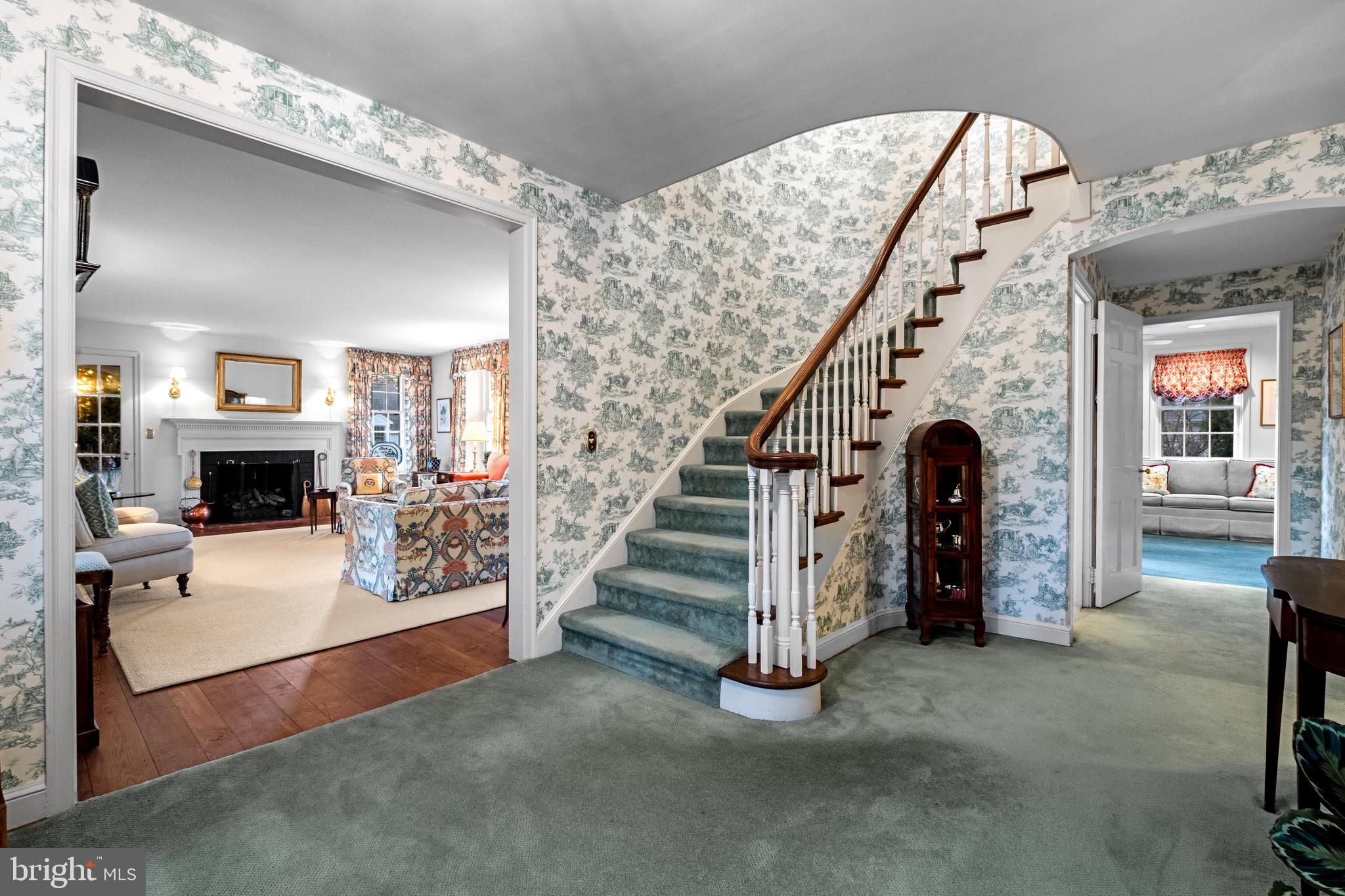 810 Merion Square Road Gladwyne, PA 19035 - Photo 4 of 32 a view of a livingroom with entryway and fireplace