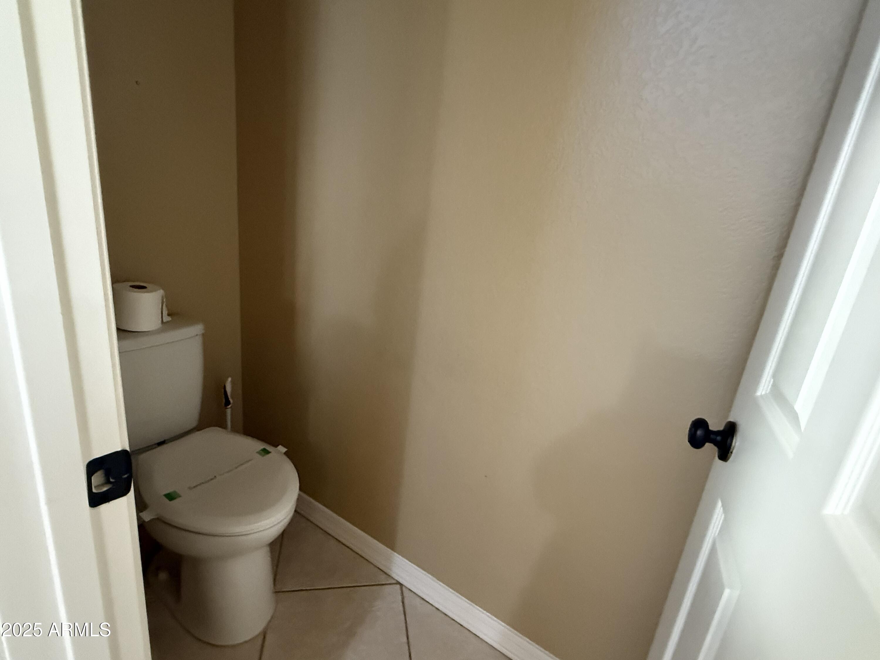 2917 East Windsong Drive Phoenix, AZ 85048 - Photo 13 of 26 a white toilet sitting next to a small window