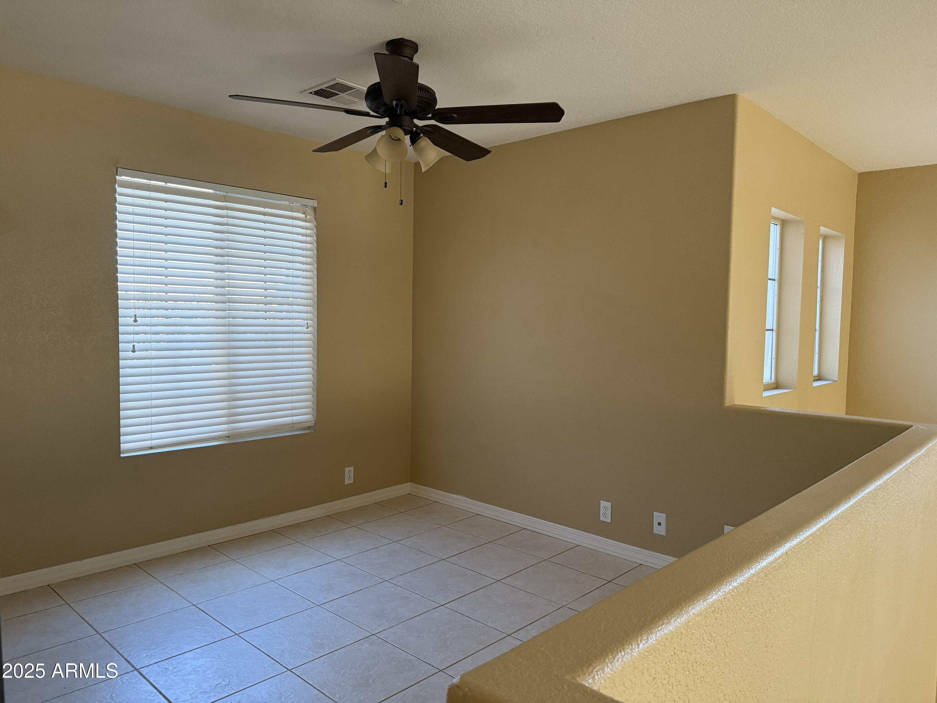 2917 East Windsong Drive Phoenix, AZ 85048 - Photo 20 of 26 a view of a livingroom with a window