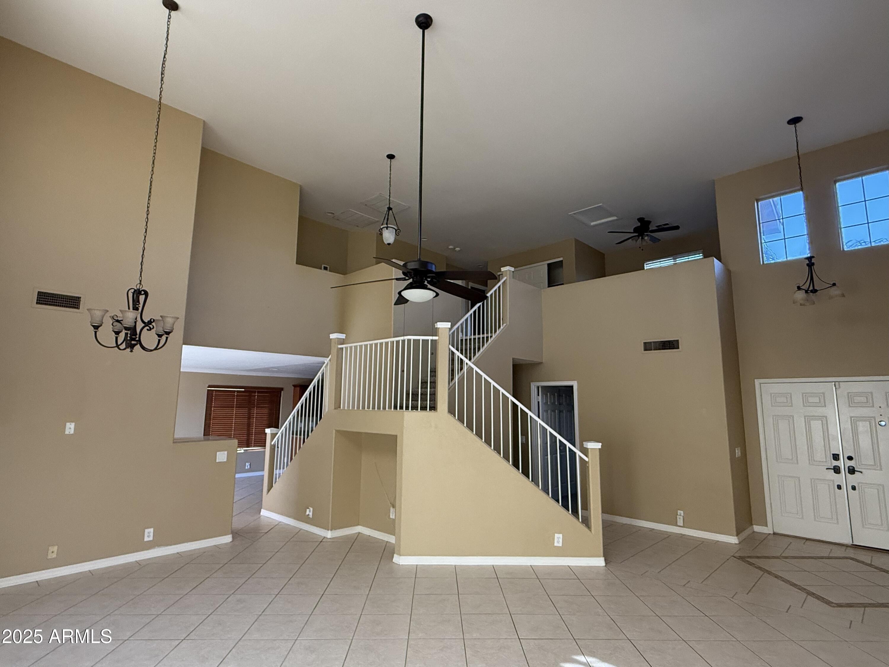 2917 East Windsong Drive Phoenix, AZ 85048 - Photo 2 of 26 a view of a livingroom with a kitchen
