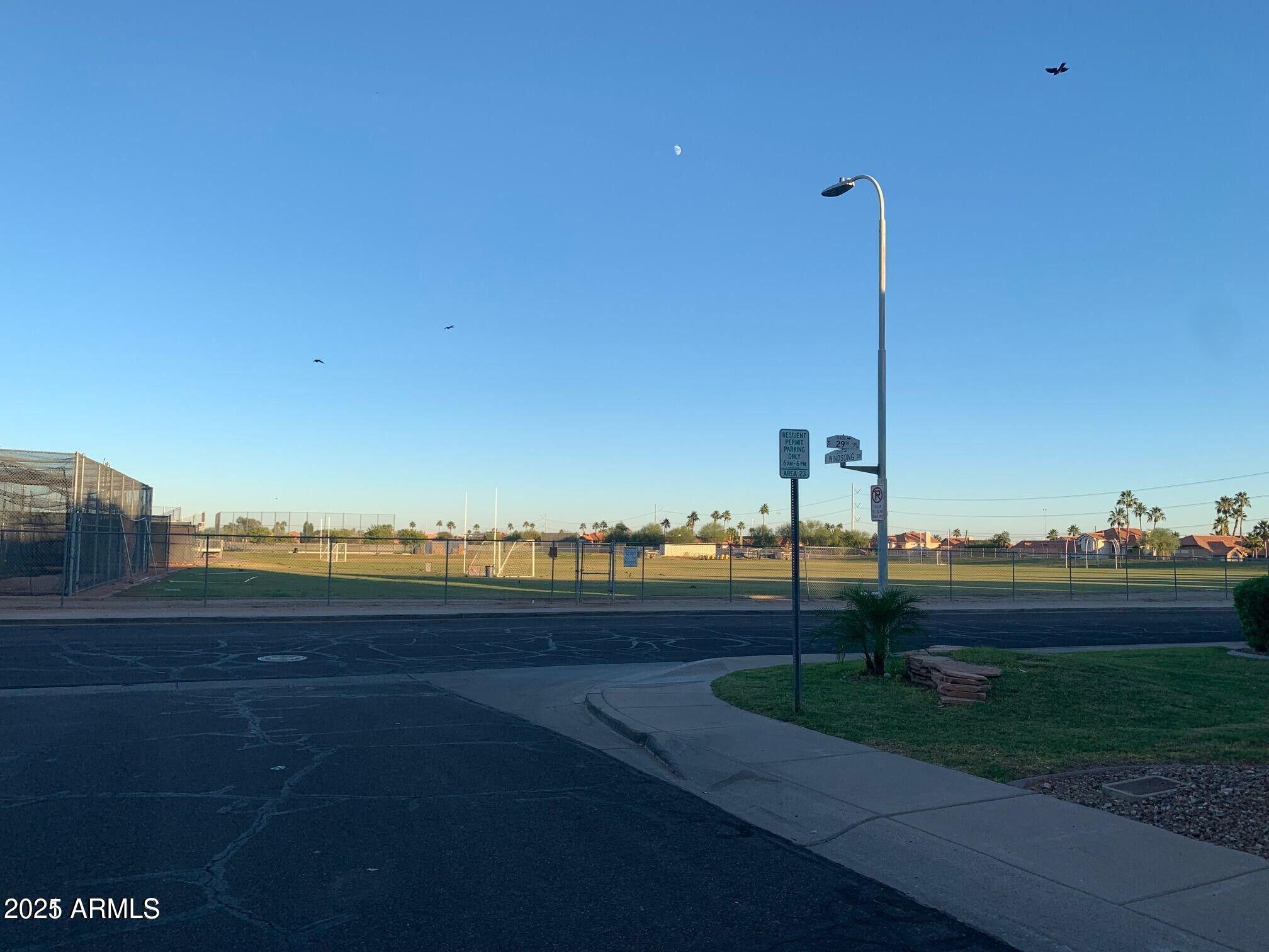 2917 East Windsong Drive Phoenix, AZ 85048 - Photo 26 of 26 a view of a pathway with a lake view