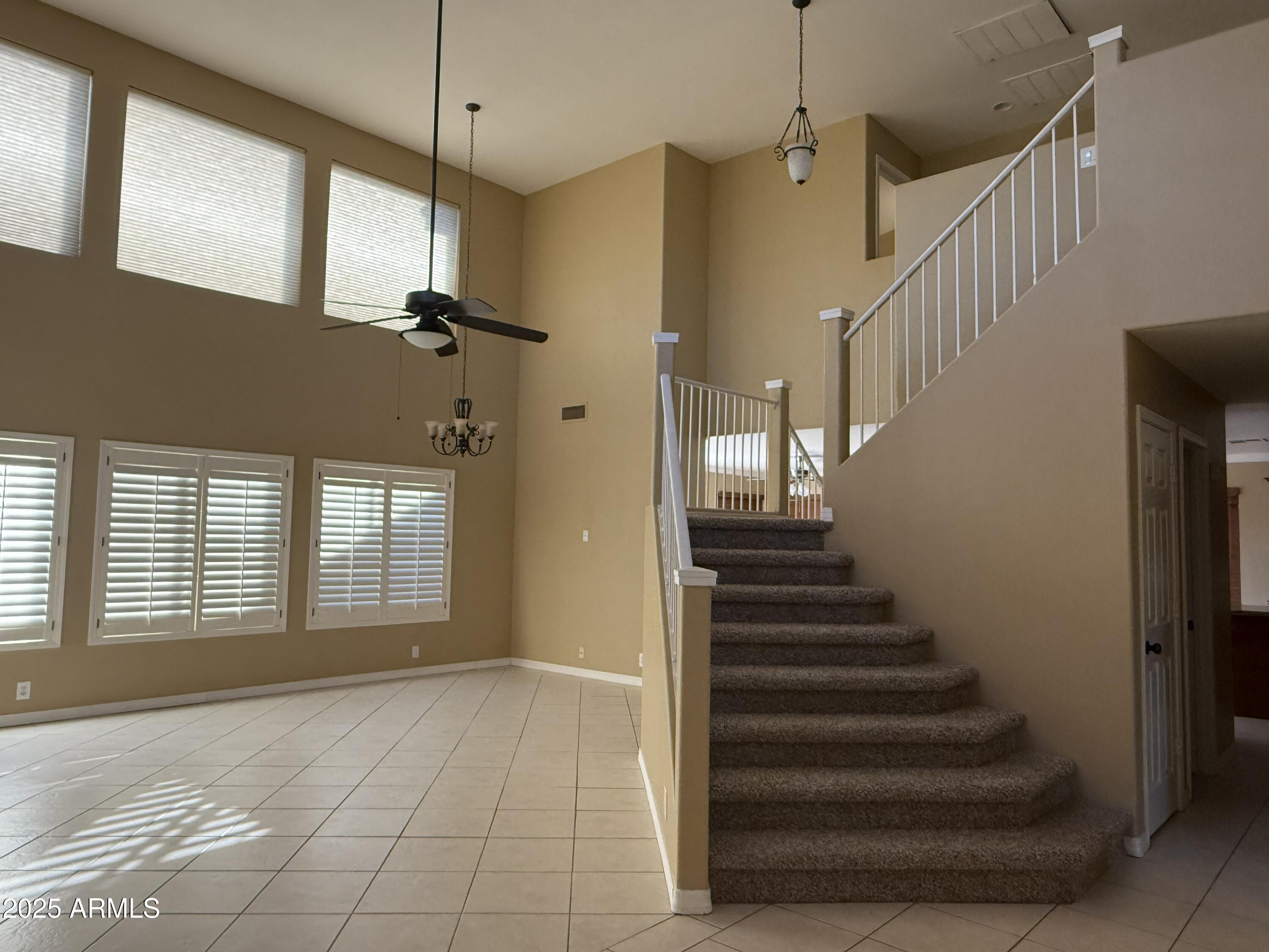 2917 East Windsong Drive Phoenix, AZ 85048 - Photo 3 of 26 a view of an entryway with staircase