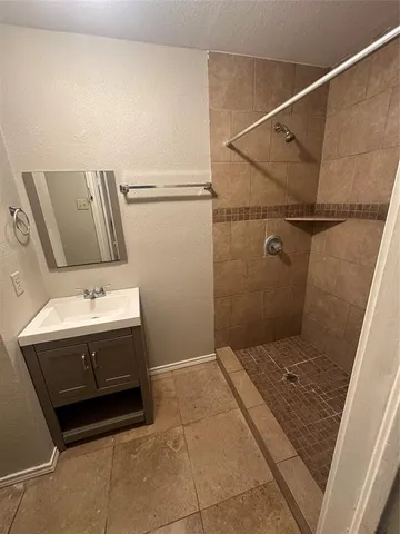 a bathroom with a sink and mirror